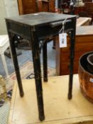 A GEORGIAN AND LATER FAUX BAMBOO TEA URN OR KETTLE STAND WITH PULL OUT CUPSLIDE, BLACK LACQUERED AND