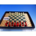 A JAQUES GREEN LEATHERETTE BOXED TRAVEL CHESS SET, THE WOODEN BOARD WITH WHITE AND GREEN SQUARES