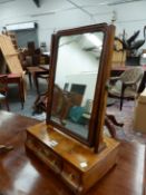 AN ANTIQUE WALNUT DRESSING TABLE MIRROR, THE RECTANGULAR PLATE ON A BOX OF THREE DOWNSWEPT FRONTED