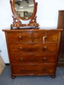 A VICTORIAN MAHOGANY CHEST OF TWO SHORT AND THREE LONG DRAWERS EACH WITH KNOB HANDLES AND ABOVE