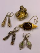 A YELLOW METAL HEAVY ORNATE CARVED CITRINE FOB, A FURTHER YELLOW METAL STONE SET BROOCH ENGRAVED