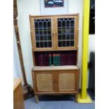 A PAIR OF COTSWOLD PALE OAK CABINETS WITH LEAD GLAZED DOORS OVER CABINETS AND DRAWERS ON SHORT