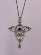 A 585K STAMPED ART NOUVEAU SAPPHIRE AND OLD CUT DIAMOND PENDANT SUSPENDED ON A WHITE METAL BELCHER