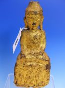 A GOLD LACQUERED WOOD FIGURE OF THE BUDDHA, SEATED. H.23cms.