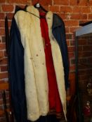 A NORWEGIAN WHITE REINDEER COAT, THE RED SILK LINING WITH LAPP COLOURED THREAD EDGING, THE BUTTONS