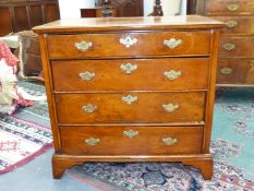 AN 18th.C. AND LATER WALNUT CHEST OF FOUR GRADED DRAWERS, EACH WITH LINE INLAID ROUNDELS ABOUT THE