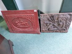 AN ART DECO CAST IRON PLAQUE TOGETHER WITH A PAINTED FIRE BACK.