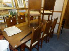 A LARGE OAK REFECTORY TABLE AND SIX CHAIRS.