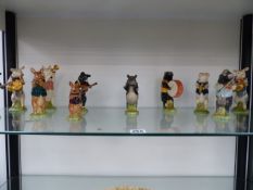 A GROUP OF TWELVE MUSICAL BESWICK PIGS.
