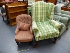 A WING BACK ARMCHAIR AND A VICTORIAN NURSING CHAIR.