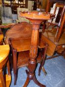 A CARVED MAHOGANY TILT TOP TRIPOD TABLE, A TORCHERE AND A FRENCH BEDSIDE CABINET.