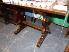 A SMALL OAK REFECTORY TABLE.