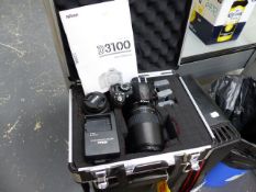 A NIKON 3100 CAMERA TOGETHER WITH LENSES, SPARE BATTERIES, CHARGER AND INSTRUCTION MANUAL IN HARD