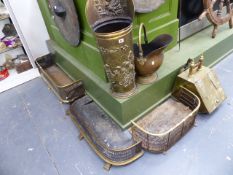 THREE VICTORIAN BRASS FENDERS, TWO COAL SCUTTLES AND A BRASS STICKSTAND.