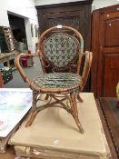 AN ANTIQUE FRENCH RATTAN CHILDS CHAIR