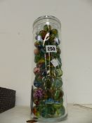 A LARGE JAR OF MARBLES.