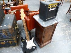 AN ELECTRIC GUITAR AND A SMALL MARSHALL AMPLIFIER.