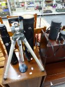 CAMERA LENSES AND A TRIPOD.