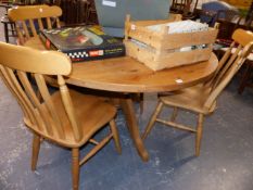 A GOOD QUALITY PINE BREAKFAST TABLE AND FOUR CHAIRS.