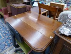 A VICTORIAN MAHOGANY DROP LEAF DINING TABLE.