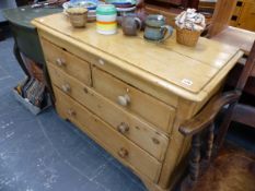 A VICTORIAN PINE CHEST OF DRAWERS.