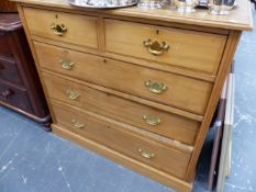 AN EDWARDIAN SATINWALNUT CHEST OF DRAWERS.