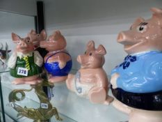 A SET OF FIVE WADE PIGS.