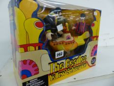 A RARE BEATLES YELLOW SUBMARINE FIGURE GROUP IN ORIGINAL BOX.