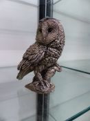 A STERLING SILVER FIGURE OF AN OWL.