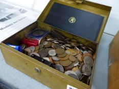 A LARGE TIN OF COINS.