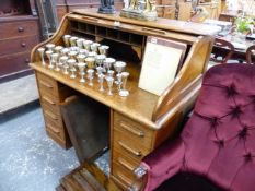 AN ANTIQUE OAK ROLL TOP DESK.