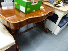 A VICTORIAN WALNUT WRITING TABLE.