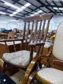 A LARGE LATHE BACK KITCHEN ARMCHAIR TOGETHER WITH A SIMILAR SPINDLE BACK CHAIR.