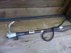 A SILVER MOUNTED RIDING CROP.