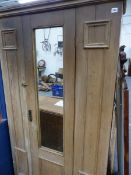 AN ANTIQUE PINE HALL CUPBOARD.