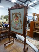 A VICTORIAN ROSEWOOD FIRE SCREEN.