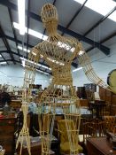 A LARGE WICKER MANNEQUIN.