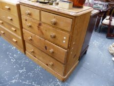 A VICTORIAN PINE CHEST OF DRAWERS.