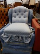 A WING BACK ARMCHAIR AND A VICTORIAN NURSING CHAIR.