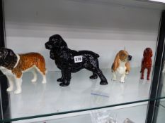 A COLLECTION OF DOG FIGURINES.