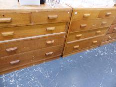 A PAIR OF OAK CHESTS OF TWO SHORT AND THREE LONG DRAWERS.