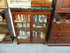 A MARBLE TOP GLAZED BOOKCASE.