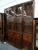 A LARGE GEORGIAN MAHOGANY BREAKFRONT BOOKCASE.