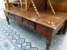 A LARGE HARDWOOD COFFEE TABLE.