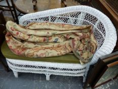 A RATTAN CHAISE LOUNGE AND AN AUBUSSON STYLE RUG.