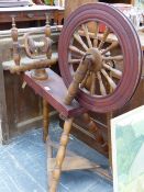 AN ANTIQUE SPINNING WHEEL.