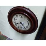 A MAHOGANY CASED WALL CLOCK WITH SPRING DRIVEN MOVEMENT.