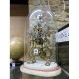 A VICTORIAN SKELETON FUSEE CLOCK UNDER GLASS DOME ON MARBLE BASE.