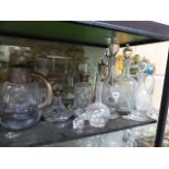 A LARGE COLLECTION OF DECANTERS AND GLASSWARES TO INCLUDE SILVER MOUNTED EXAMPLES.