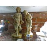 A PAIR OF ROYAL WORCESTER BLUSH IVORY FIGURINES.